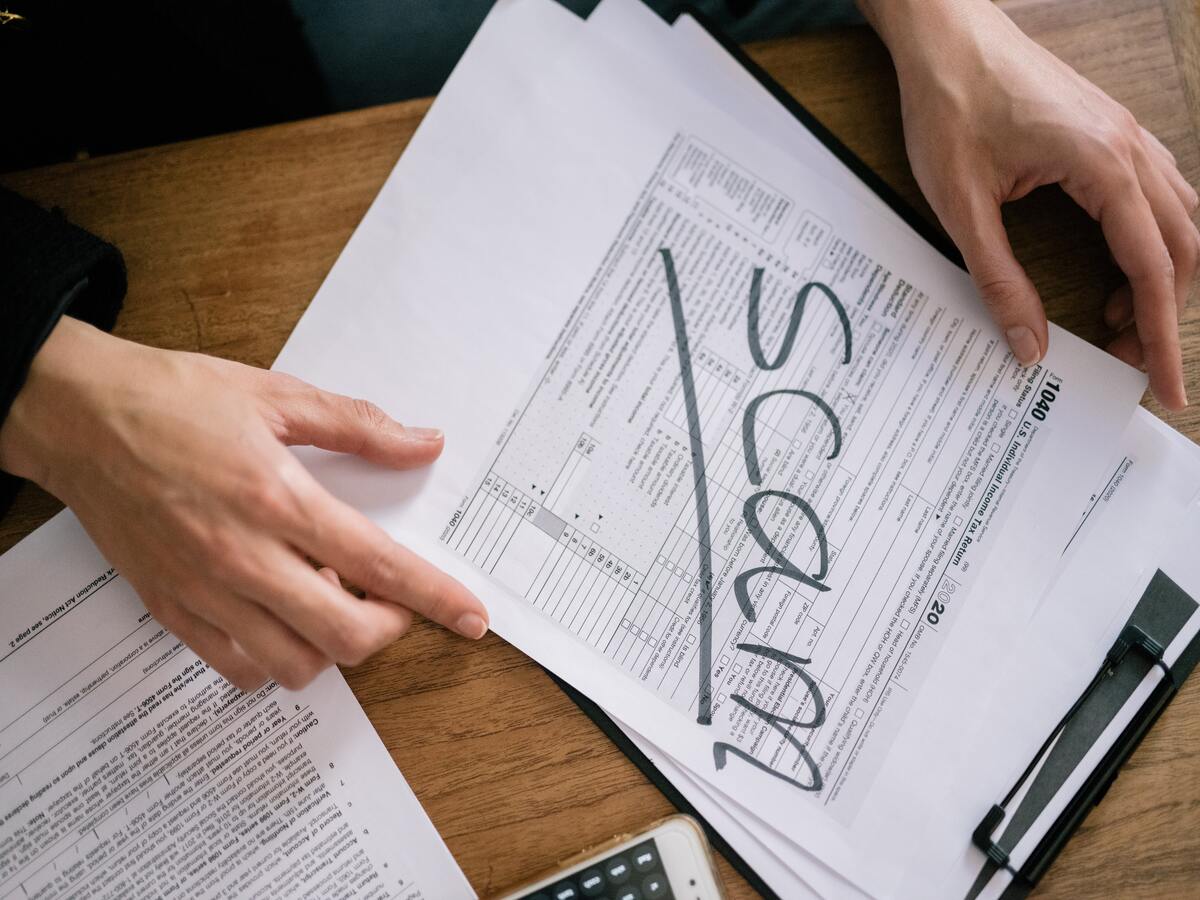 paper work with SCAM sign