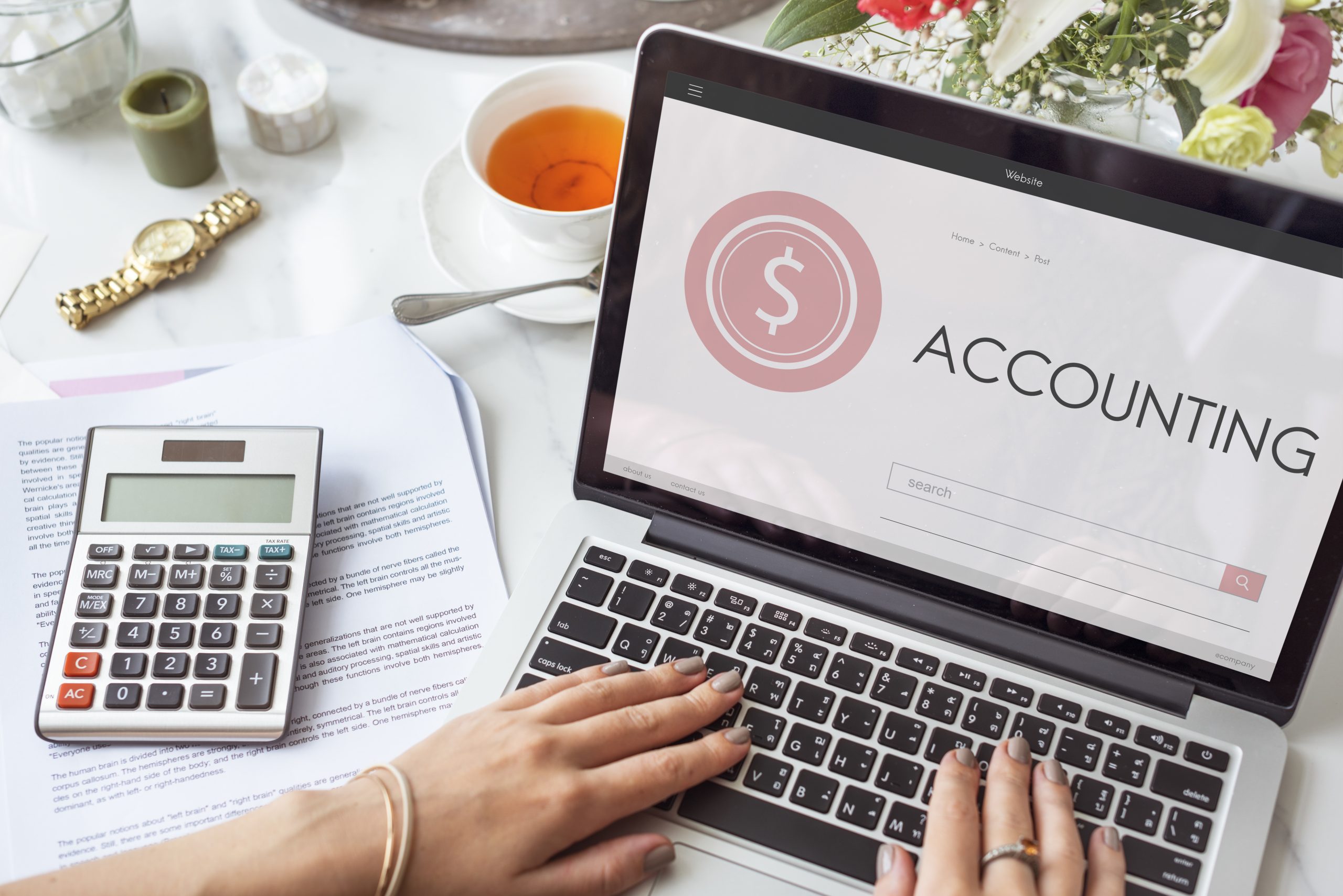a person typing in a laptop (what is account payable in accounting)