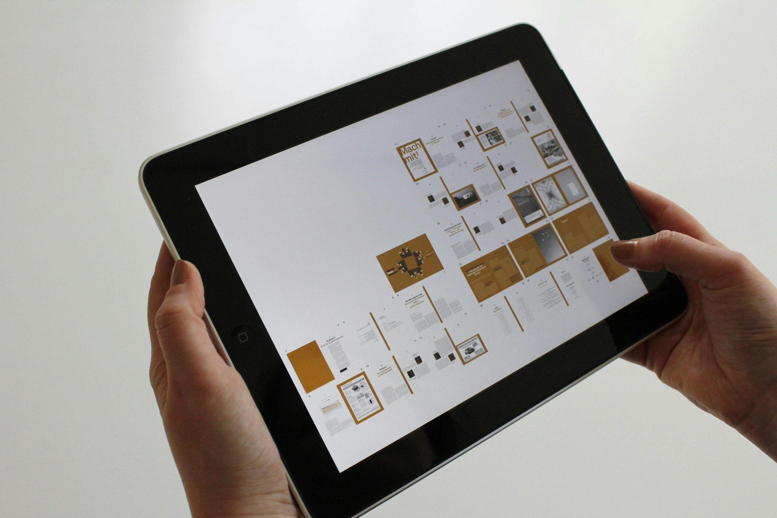 Person Holding Black Ipad (digitizing accounts payable workflow)