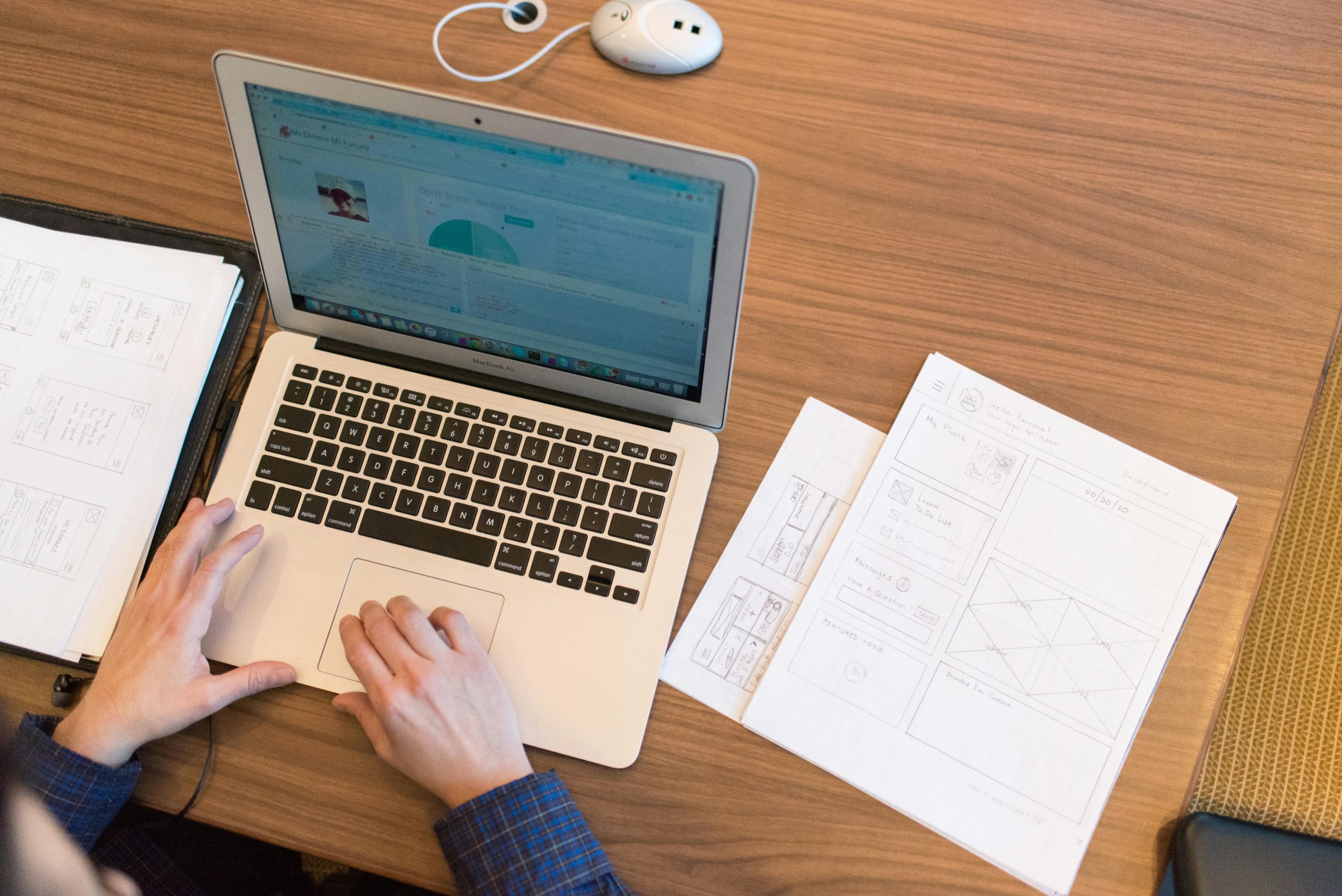 Person's Hands on Top of Macbook Air (how ocr technology extracts text from documents)
